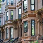 New York, row of brownstone apartment buildings with bay windows